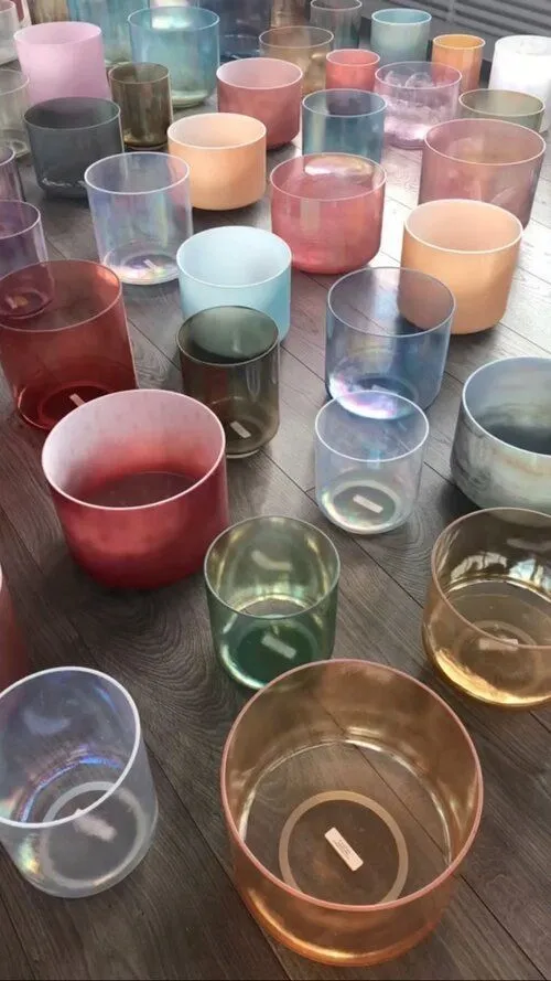 Colorful crystal singing bowls tuned to different frequencies